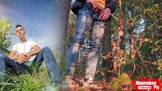 Stud lengthy peeing in the woods under a tree